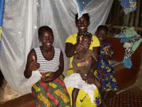 Sallay & her children under their bed net