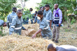 MTTI Trainees working on the compost piles