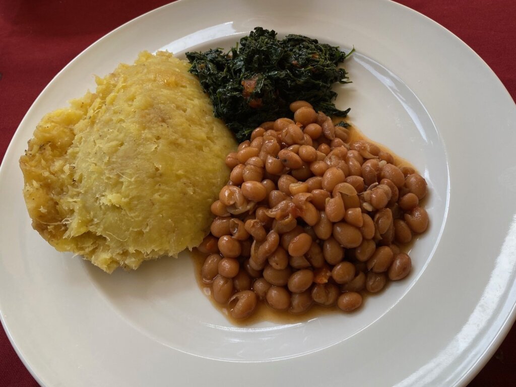Matooke served with beans and greens