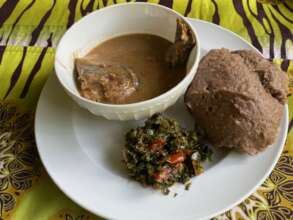 Millet ugali served with pasted fish and greens