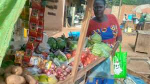 Beneficiary at her vegetables stall
