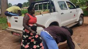 Women tree seedling growers load sold seedlings