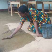 Using cow dung to seal lunch shed floor