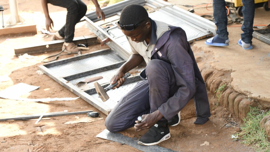 Okello during his welding apprenticeship