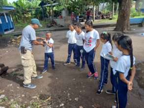 Junior Rangers learning how to use binoculars
