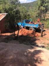 Unloading bricks for classroom construction
