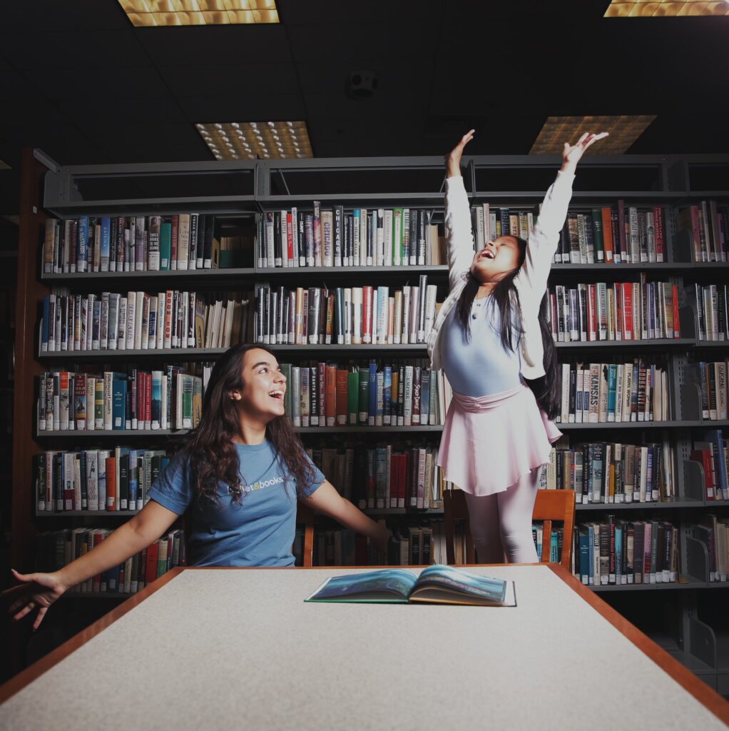 Perla and her mentor in the library