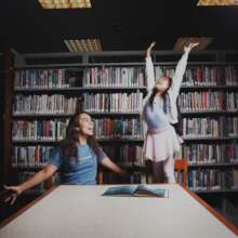 Perla and her mentor in the library