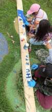Children participating in the orchard creation