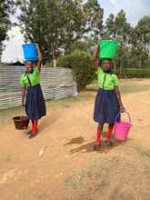 Children carrying water from the creek, 1 km away