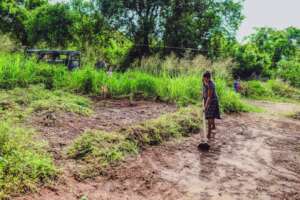 This single mother of three preparing the soil