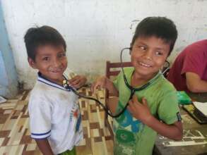 Clinic goers use a stethoscope for the first time