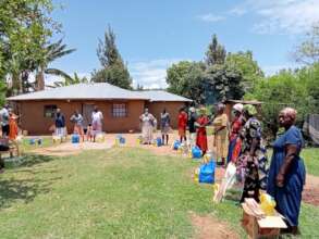 Caregivers Meeting Together to Receive Supplies