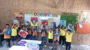 Second graders with bottle cap art!