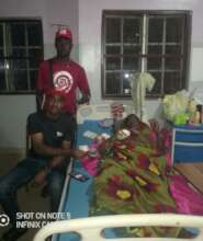 Our Project Leader supporting the woman with money