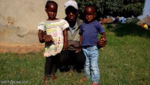 Charles Olupot with kids born COVID-19 period