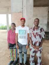 Our Project Leader with the orphan and guardian