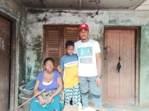 Our Project Leader with the orphan and grandmother