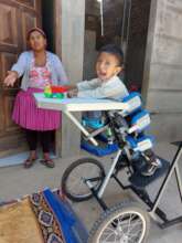 Axel using the personalized stander in his home