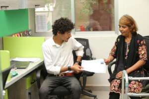 Sara receiving her Disability Certificate!