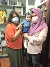 Baby Noor receiving check up at 2 month mark
