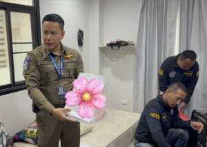 TICAC Police show evidence with offender