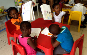 Pre-schoolers with their new workbooks
