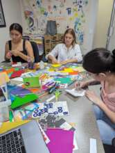 Volunteers at the office making cards for donors