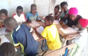 A teenage Young Leader teaching