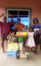 Tammy, presenting donated items to Chimdi parents