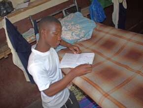 Student studying in the boarding school room