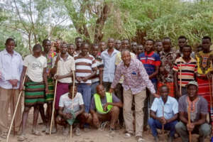 Hilary from CPIK with tribal warriors and elders