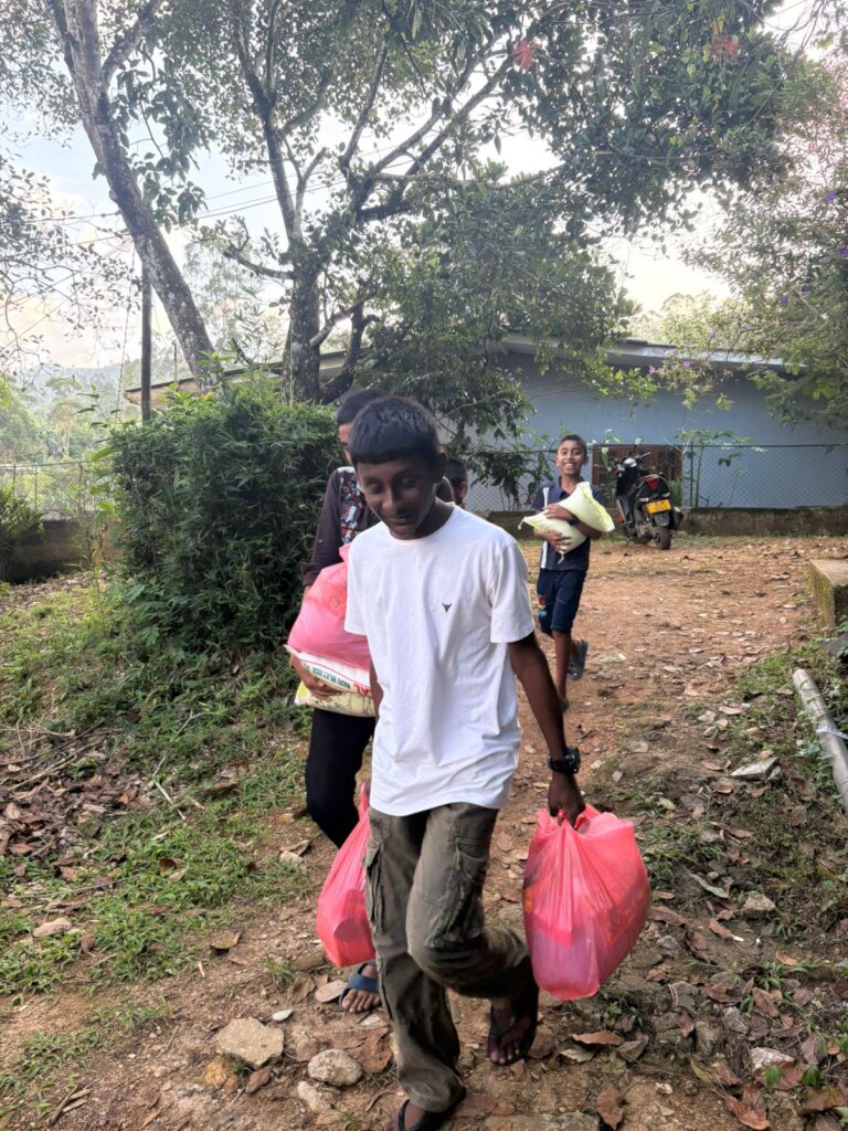 Local kids help with food distribution