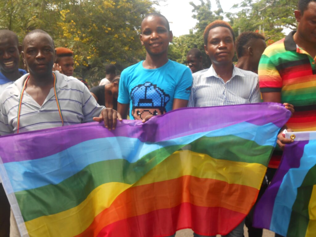 LGBTQ Tanzanians holding a pride flag