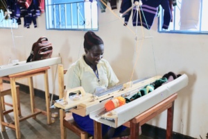 A beneficiary trained in knitting