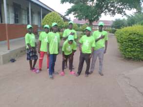 The school volunteers work together to plant trees