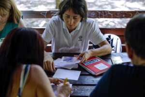Cristina distributes cash vouchers to refugees