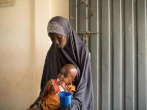 Two-year-old Mowlid eats a protein peanut paste