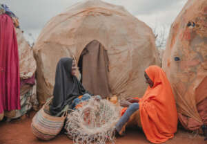 Nunay with Bisigow weaving baskets.