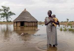 Abuk, 30, holds her daughter, 4.