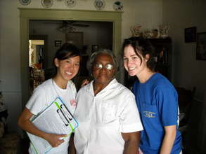 Volunteers with Recipient of CFL Installation