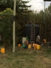 people fetching water from the water harvesting
