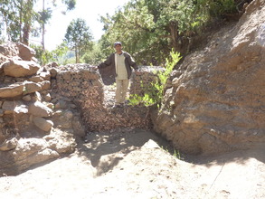 the first gabion check dam half filled with sand
