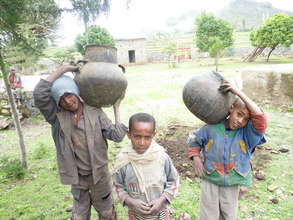 school children bring the clay pots