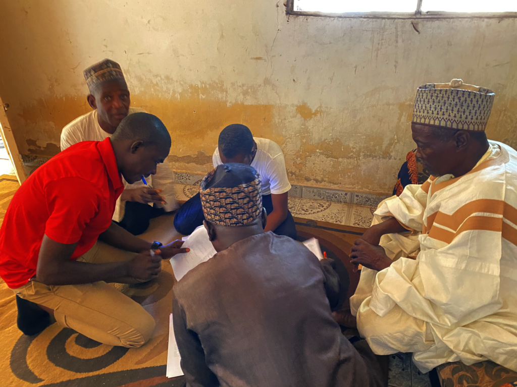 LI staff member works with community members