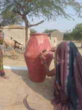 Poor women making Nadi hole