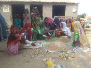 Women making sand smaples