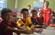Feeding children in San Juan Bautista, Peru