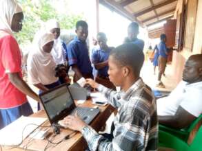 Officer capturing details of student for an NHIS c
