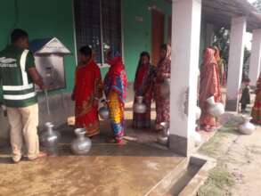 women collecting save drinking water